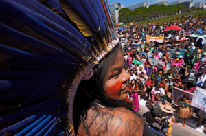Guajajara speaks to Indigenous women from across Brazil at a march in Brasília this month. Photograph: Eraldo Peres/AP