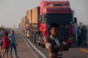 Kayapó indigenous people from the ‘Baú’ and ‘Menkragnoti’ villages block the BR-163 highway in protest in 2020. The railroad would bring additional transport capacity to the soy highway that currently connects the Cerrado to the Miritituba port in Pará, and could impact six Indigenous territories and three isolated tribes. Photograph: NurPhoto/Getty Images