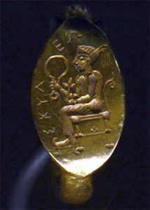 The Enaree were a part of an orgiastic cult of the major Scythian goddess, Artimpasa. In the image, the seated goddess Artimpasa, depicted on the ring of King Scyles. (Public domain)