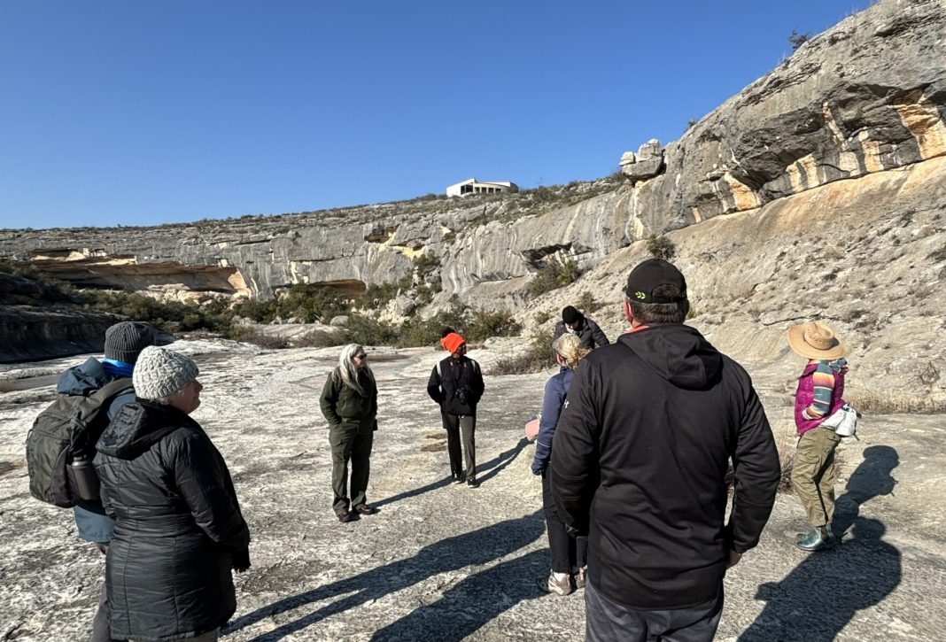 Seminole Canyon State Park Interpretive Center. Tanya Petruney at center left guides tour by Jack Morgan