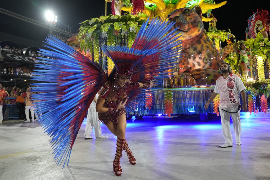 A performer from the Salgueiro samba school parades during Carnival celebrations at the Sambadrome in Rio de Janeiro, Brazil, early Monday, Feb. 12, 2024. (AP Photo/Silvia Izquierdo)