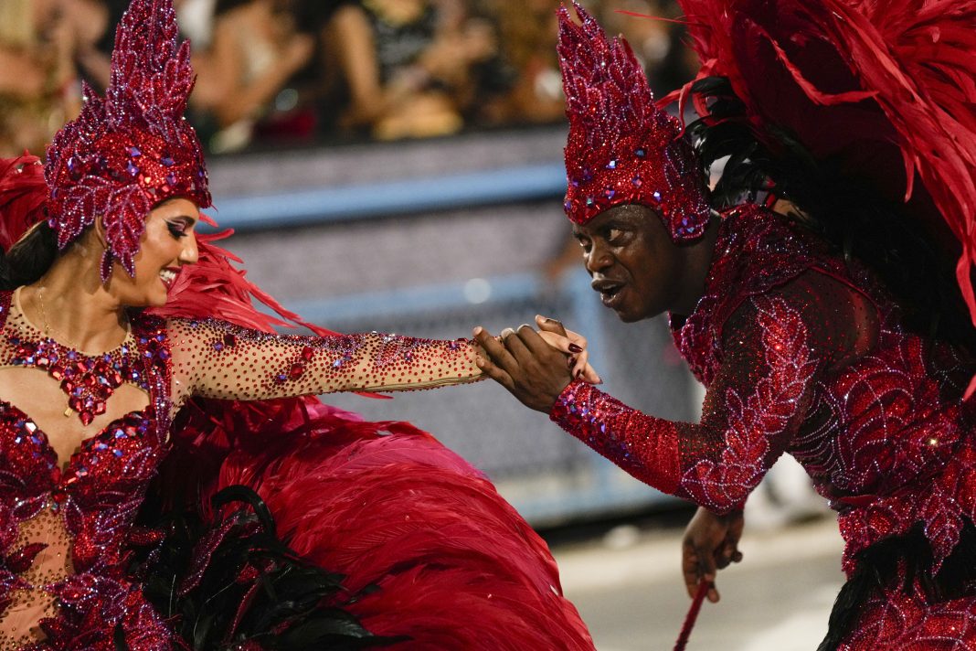 Performers from the Salgueiro samba school parade during Carnival celebrations at the Sambadrome in Rio de Janeiro, Brazil, Monday, Feb. 12, 2024. (AP Photo/Silvia Izquierdo)