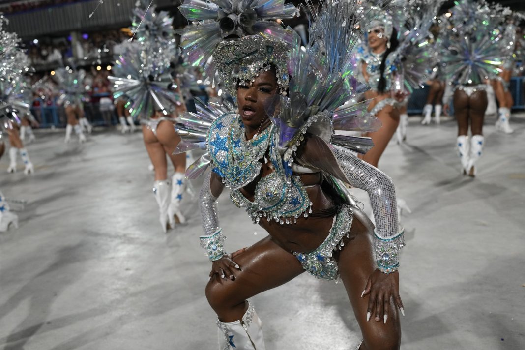 Performers from the Salgueiro samba school parade during Carnival celebrations at the Sambadrome in Rio de Janeiro, Brazil, early Monday, Feb. 12, 2024. (AP Photo/Silvia Izquierdo)
