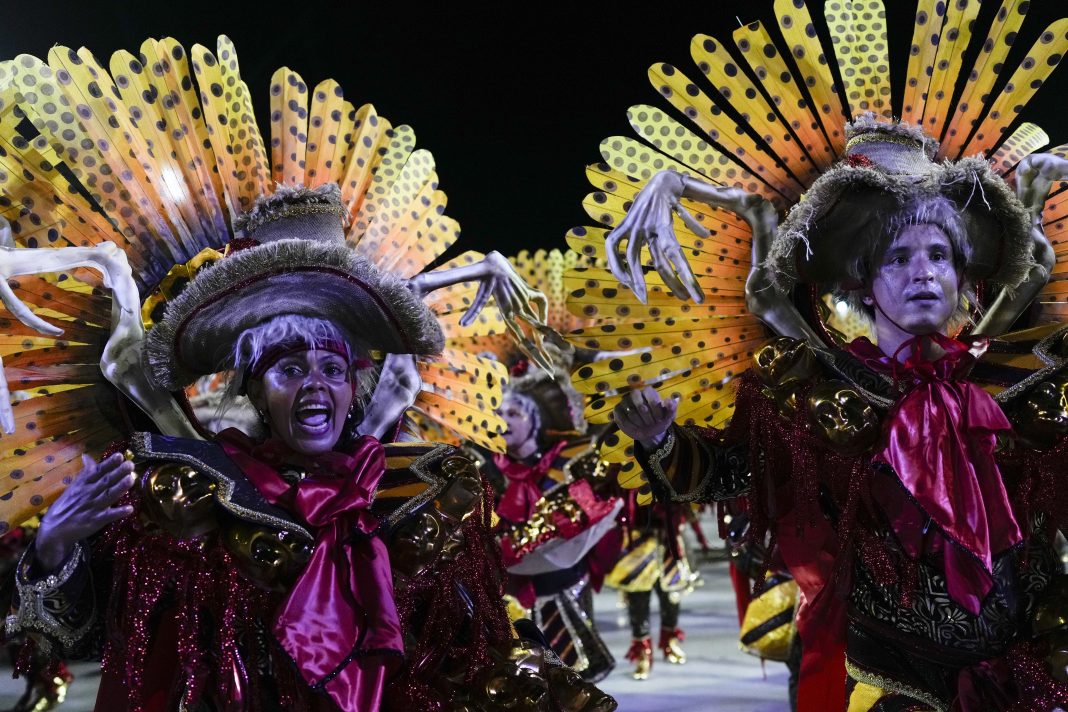 Performers from the Salgueiro samba school parade during Carnival celebrations at the Sambadrome in Rio de Janeiro, Brazil, early Monday, Feb. 12, 2024. (AP Photo/Silvia Izquierdo)