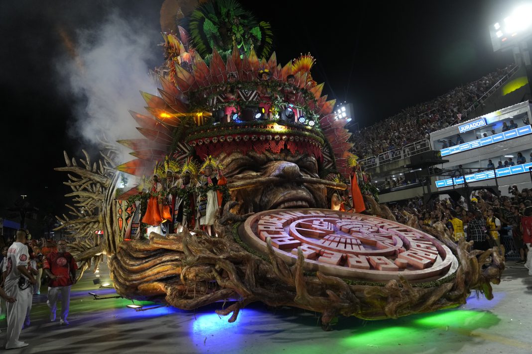 Performers from the Salgueiro samba school parade on a float during Carnival celebrations at the Sambadrome in Rio de Janeiro, Brazil, early Monday, Feb. 12, 2024. (AP Photo/Silvia Izquierdo)