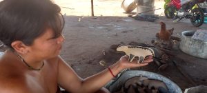 People of Topepeweke Village painting the sculpture. Pic: Migrate Art