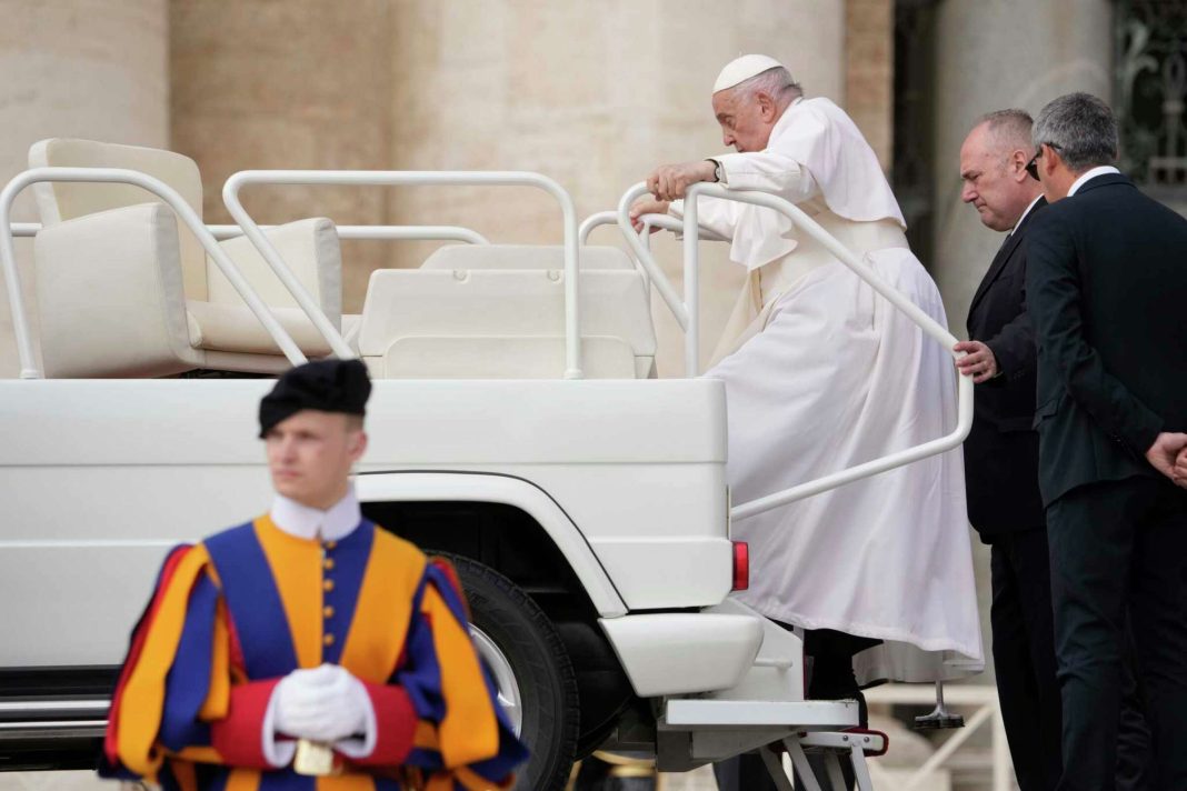 Pope Francis climbs on the popemobile after his weekly general audience in St. Peter's Square at The Vatican, Wednesday, April 10, 2024. Andrew Medichini/AP