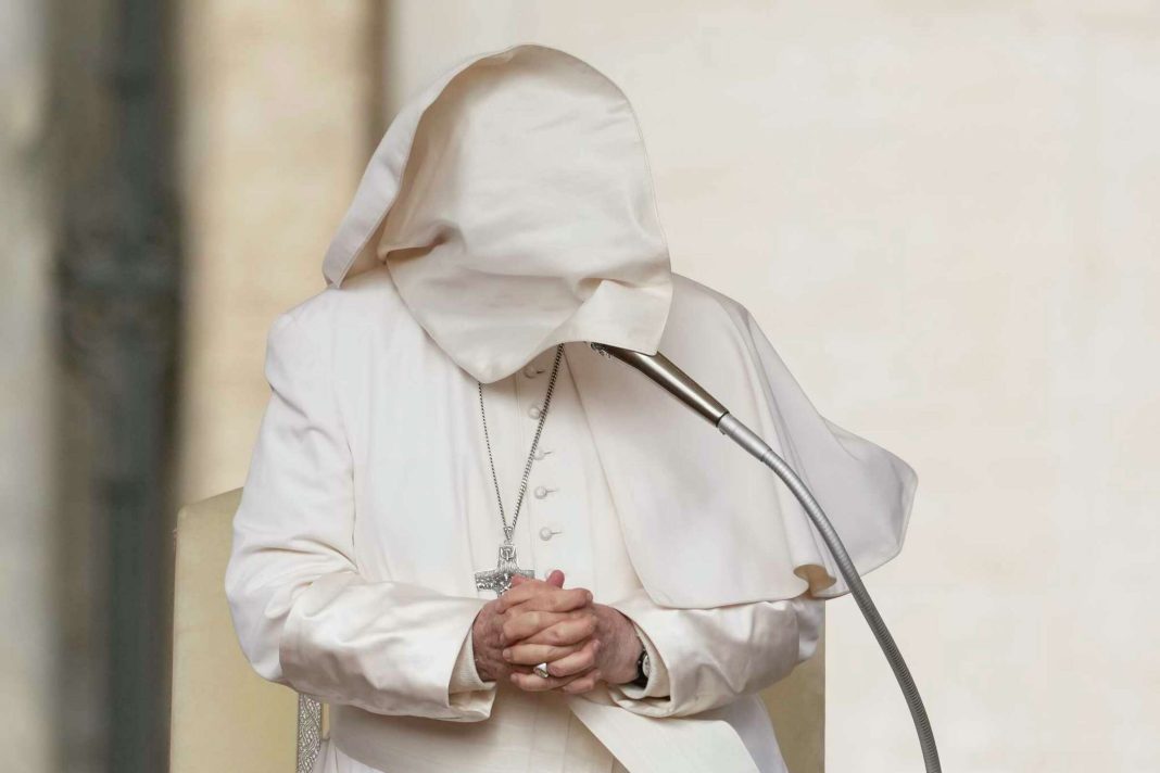 A gust of wind blows Pope Francis's mantle as he stands during his weekly general audience in St. Peter's Square at The Vatican, Wednesday, April 10, 2024. Andrew Medichini/AP