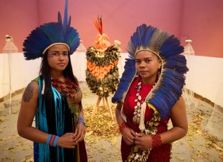 Part protest, part rave: the Indigenous artists stunning the Venice Biennale Glicéria Tupinambá (right, with her niece Jessica) in the Brazilian pavilion at Venice, which features the Tupinambá cloak, along with letters asking for its return. Photograph: David Levene/The Guardian