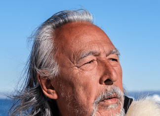 Angaangaq Angaangaq is a shaman, traditional healer, storyteller and carrier of the Qilaut (winddrum),