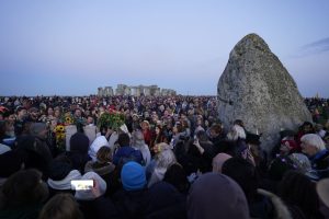Crowds at Stonehenge in Wiltshire during sunrise (Andrew Matthews/PA)