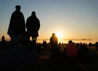 Thousands flock to Stonehenge to celebrate summer solstice People watch the sun rise as they take part in the summer solstice at Stonehenge in Wiltshire