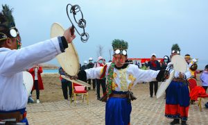 Performers dressed in shaman attire dance in a ceremony. Photo: VCG