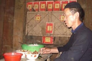 The shaman performs a naming ceremony for a new born baby.