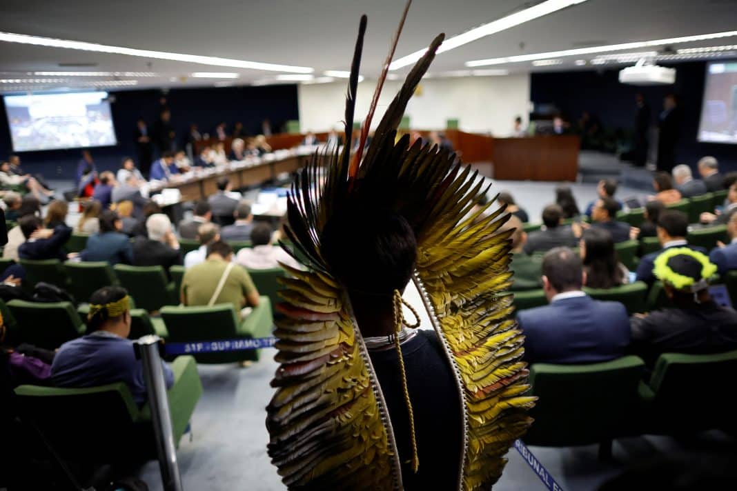 Indigenous people attend a meeting of the conciliation committee hearing to discuss the case of the so-called 'Marco Temporal' (Temporal Milestone) legal thesis in the Supreme Court in Brasilia, Brazil August 5, 2024. REUTERS/Adriano Machado Purchase Licensing Rights