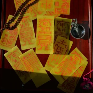 Photo of Korean talisman paper covering a table."Bujeok" are talismans that ward off evil spirits and bring good fortune.

Courtesy of Jennifer Kim