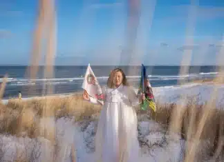 How one shaman helps others find healing and meaning in a modern world Helena Soholm holds up the five directional flags of Korean shamanism in Dronningmølle, Denmark.