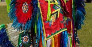 The cuff design on White’s regalia represents a vision from his dreams. The colours reflect the Ojibwe medicine wheel. Many traditional dancers choose to wear these colours to invoke the wheel’s teachings.