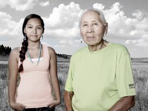 Northern Cheyenne tribe members, a young woman and her grandmother, pose for a portrait.Jennie Parker and granddaughter Sharlyce, Northern Cheyenne.Matika Wilbur
