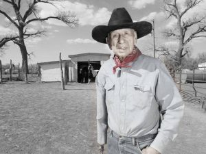 A Native American man in a cowboy hat and red bandana poses for a portrait.Leon Grant, Omaha.Matika Wilbur