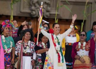 Mexican leader’s fashion honors the Indigenous FILE - President Claudia Sheinbaum waves to supporters in the Zócalo, Mexico City's main square, on the day of her inauguration, Oct. 1, 2024. (AP Photo/Fernando Llano, File)