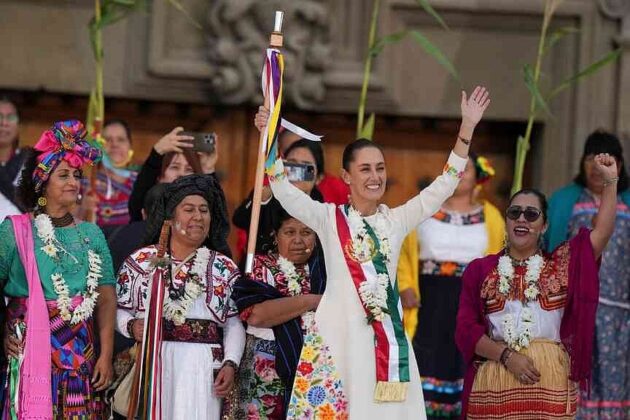 FILE - President Claudia Sheinbaum waves to supporters in the Zócalo, Mexico City's main square, on the day of her inauguration, Oct. 1, 2024. (AP Photo/Fernando Llano, File)